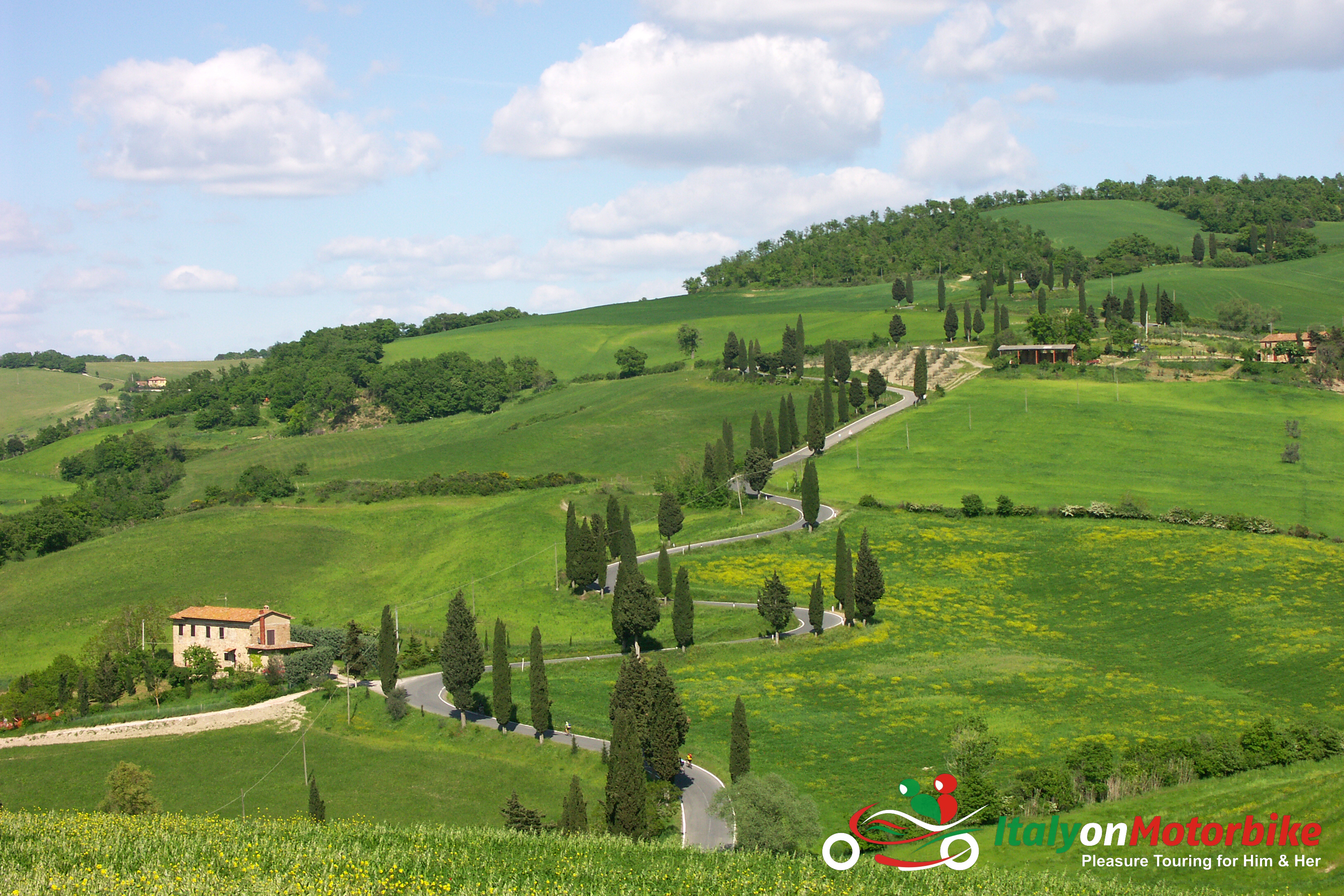 A rolling green Tuscan Chianti hill from our classic motorcycle tour of Tuscany